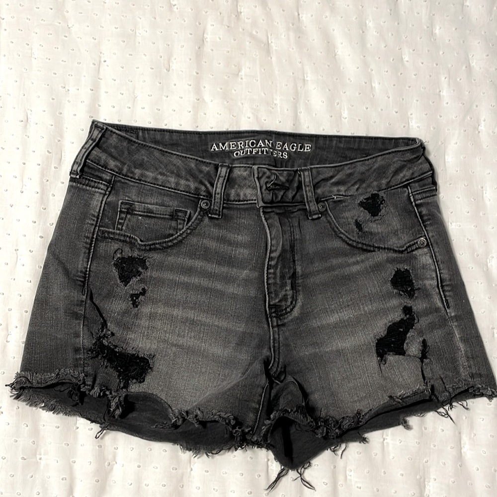 Faded black ripped jean shorts
